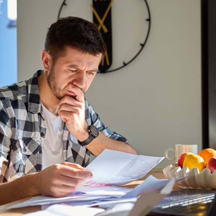 Man with Papers - 5050 Desktop.jpg Man with Papers - 5050 Desktop.jpg