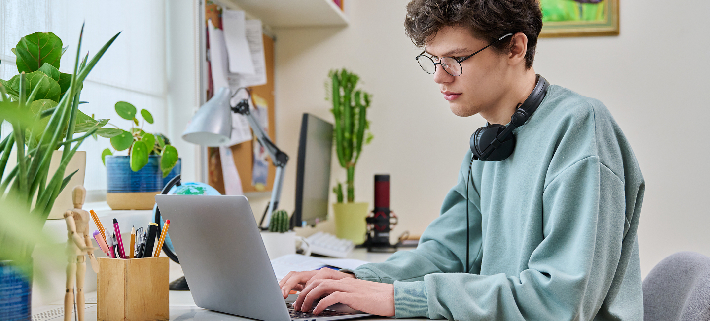 Student Working Lockup - Full Width Desktop.jpg Student Working Lockup - Full Width Desktop.jpg